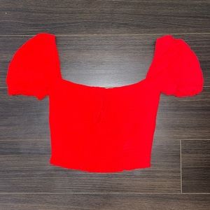 Fitted red blouse with slight puff sleeves